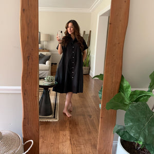 Social media selfie shot featuring the Yara midi dress in black.